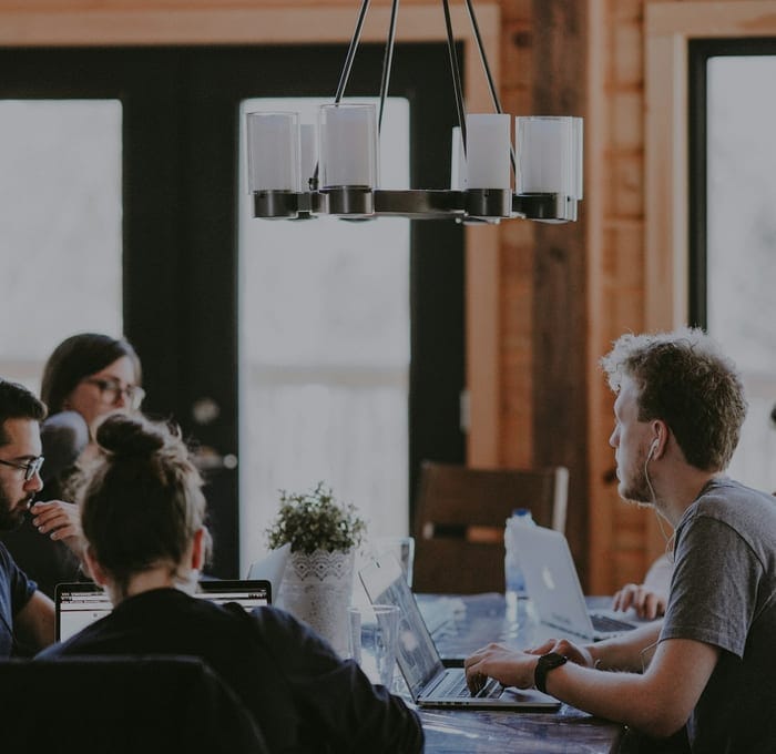 A team working together at a long table